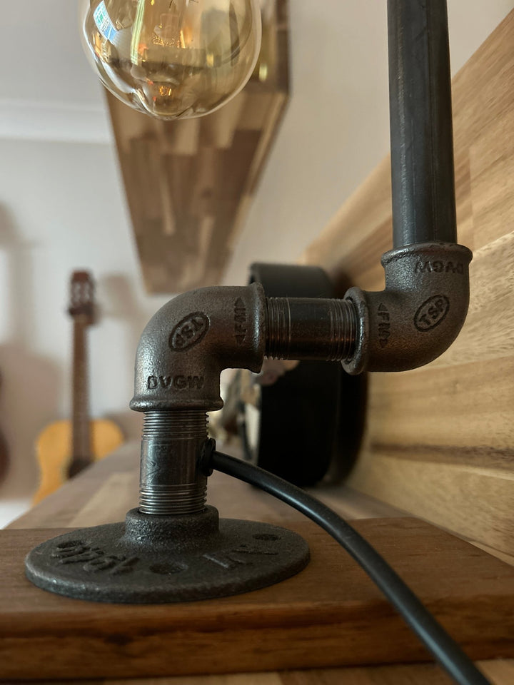 close up of pipework pieces that make up the industrial standpipe lamp