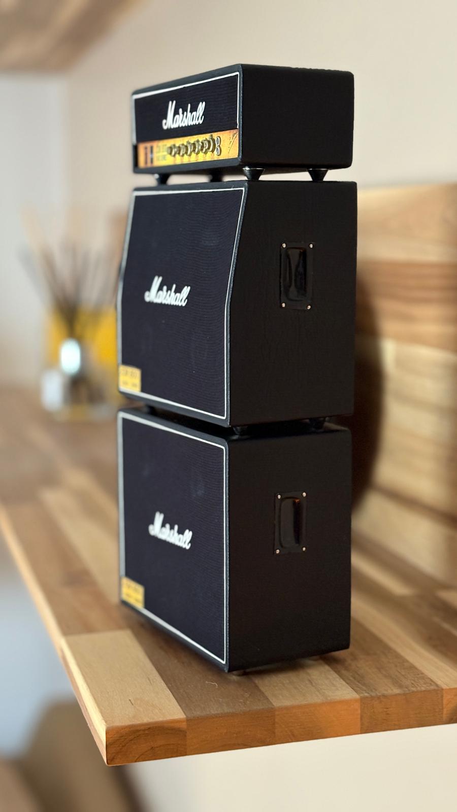 Double Stack of miniature Marshall amplifier models on a wooden surface