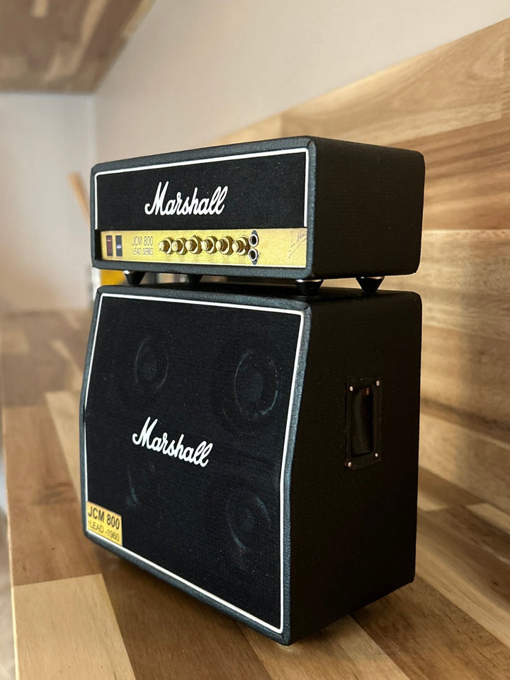 Miniature Single Marshall amplifier stack on a wooden surface side view