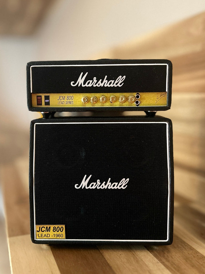 Miniature Single Marshall amplifier stack on a wooden surface 