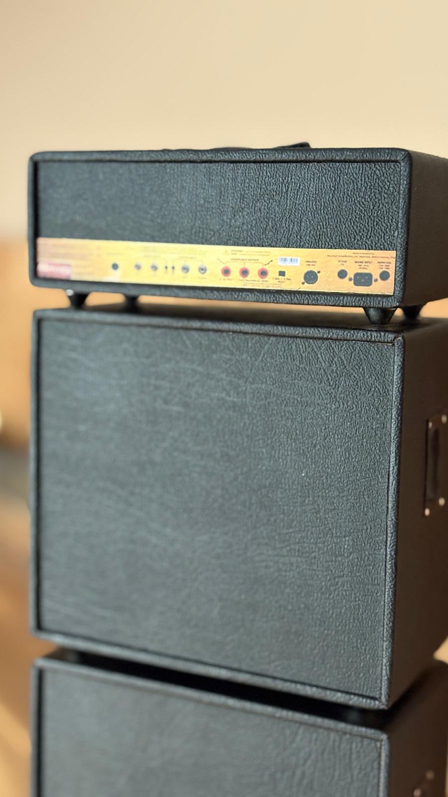 reverse side of miniature marshall amp Stack with a focus on the top one.
