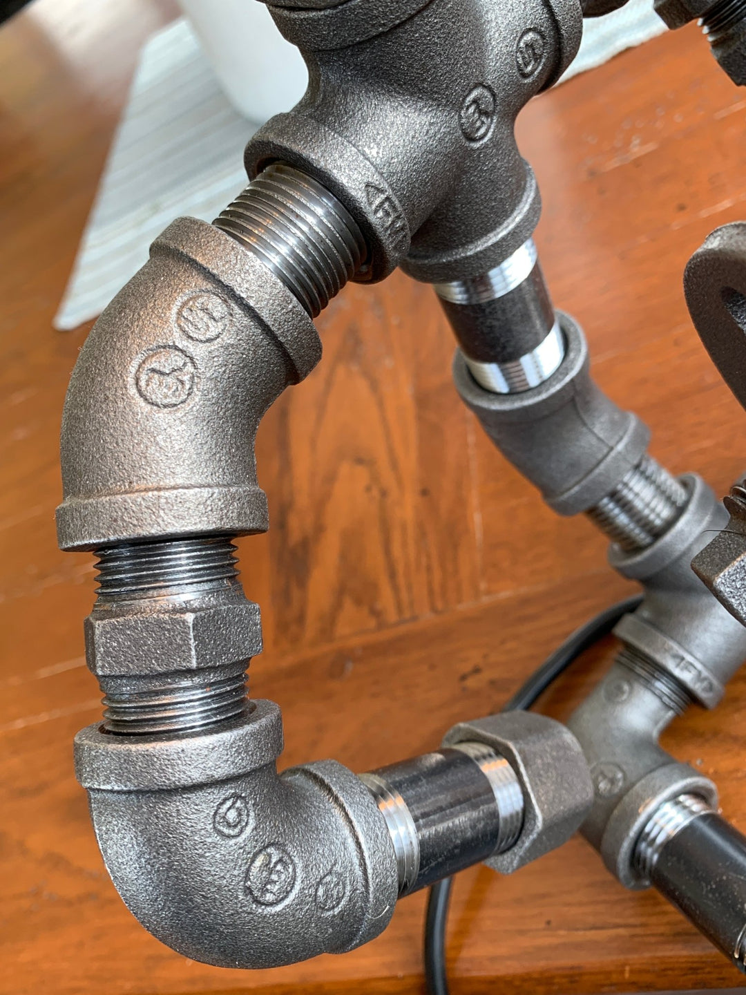 photo showing the pipe parts that the guitar hero lamps are made from